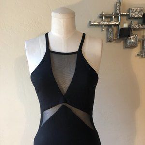 Black body-con cocktail dress with net cut-outs